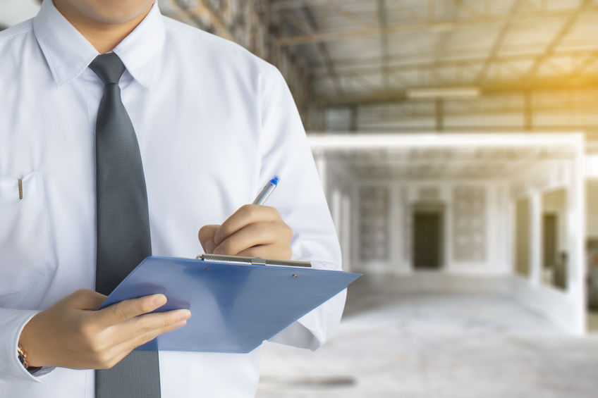 Male engineer inspection writing in factory With note on notepad Male engineer inspection writing in factory With note on notepad